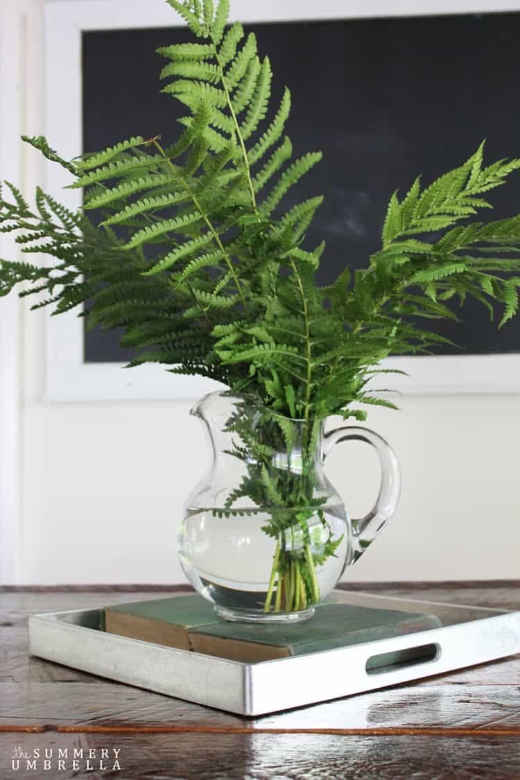 Creating a beautiful spring centerpiece doesn't have to be complicated, or even involve a lot of money. See how with this simple fern spring centerpiece!