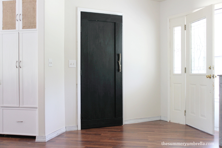 Designing your own custom DIY reclaimed wood paneled door doesn't have to be a chore. Let me show you how to make one now!