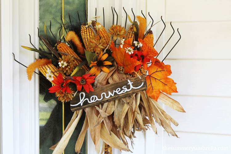 All you need to make this festive DIY fall rake decor is an old rake, some fall foliage and dried corn to create this beauty!