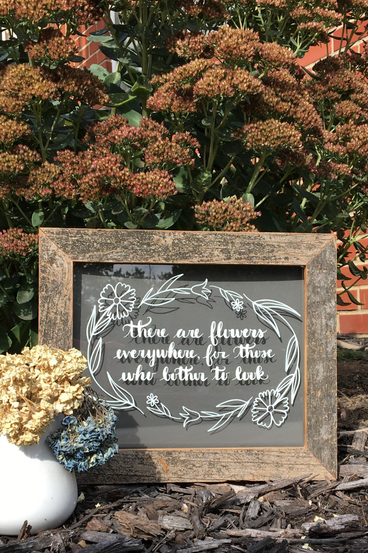 Learn how to make a There are Flowers Everywhere DIY Glass Sign for your home, as a gift for a wedding or any occasion. You can easily make this wall decor from a picture frame or old windows. #vinylprojects #svg #thesummeryumbrella