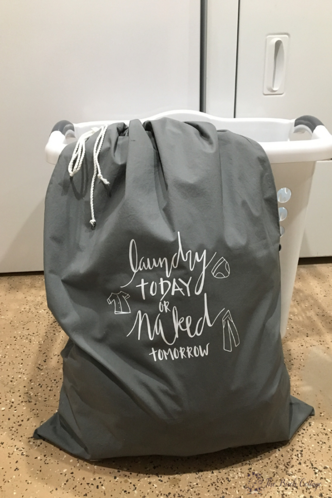 This DIY pillowcase laundry bag is an earth-friendly way to store dirty clothes when traveling and can double as a wash bag for fine washables! #cricut #svgfiles #thesummeryumbrella