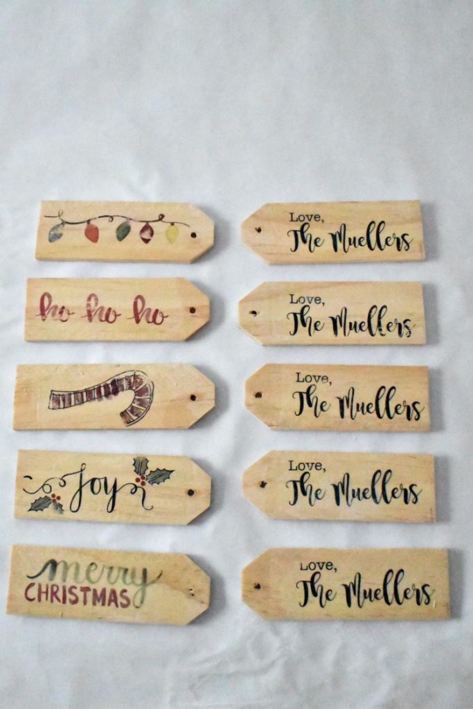 Easily personalize a Christmas gift with a creative DIY gift tag.  There are a lot of gift tag ideas to choose from, but these handmade wooden gift tags are super easy and cute, and can double as ornaments for next Christmas! #gifttags #christmas #thesummeryumbrella