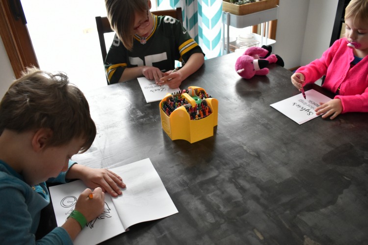 kids coloring on DIY coloring book