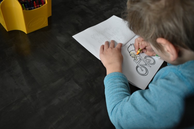 kids coloring on DIY coloring book