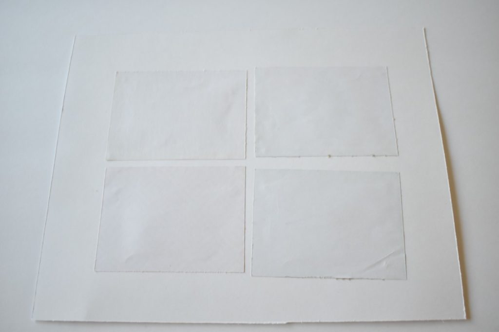 the backside of cardstock after glueing scrapbook paper