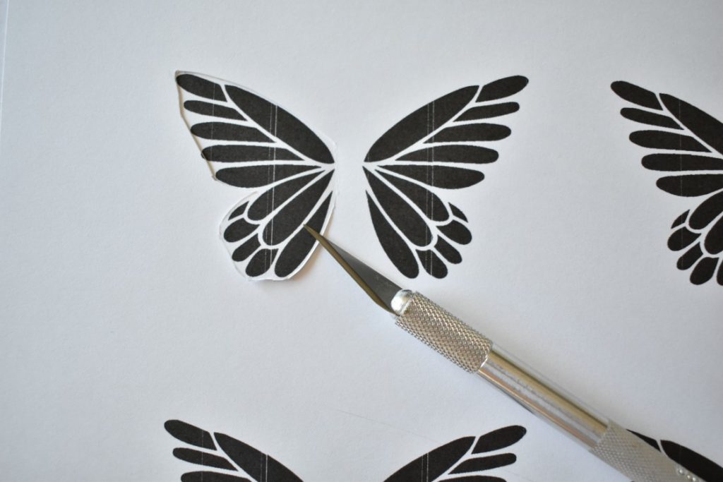 butterfly art getting cut from cardstock