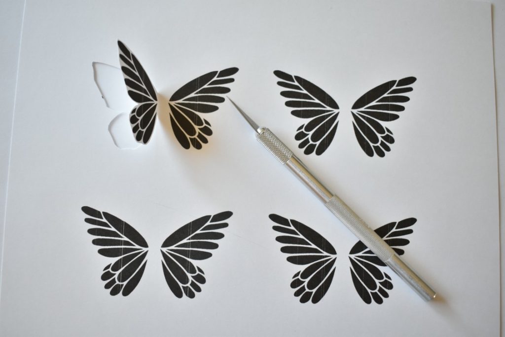 butterfly art getting cut from cardstock