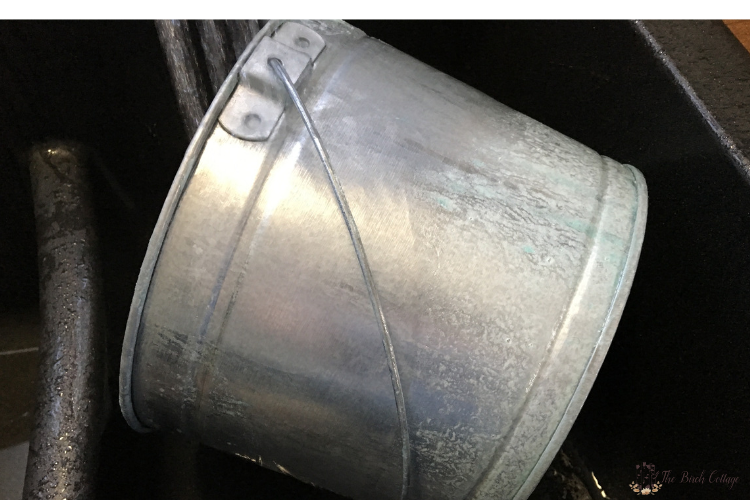 preparing a galvanized pail for painting