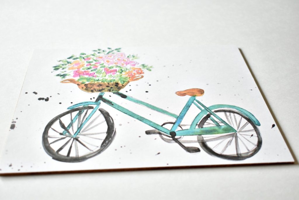 watercolor bicycle on the backing of a shadow box
