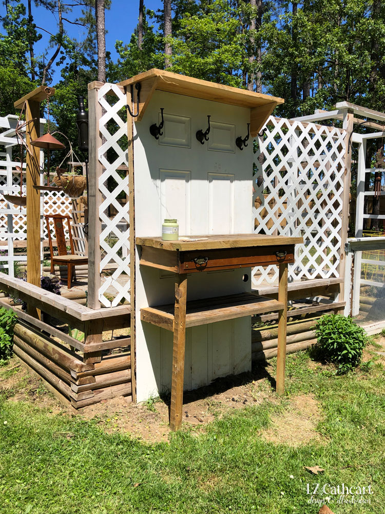 Get ready to enjoy gardening like never before with your own DIY potting bench made from an old door. #PottingBench #DIY #GardeningGoals