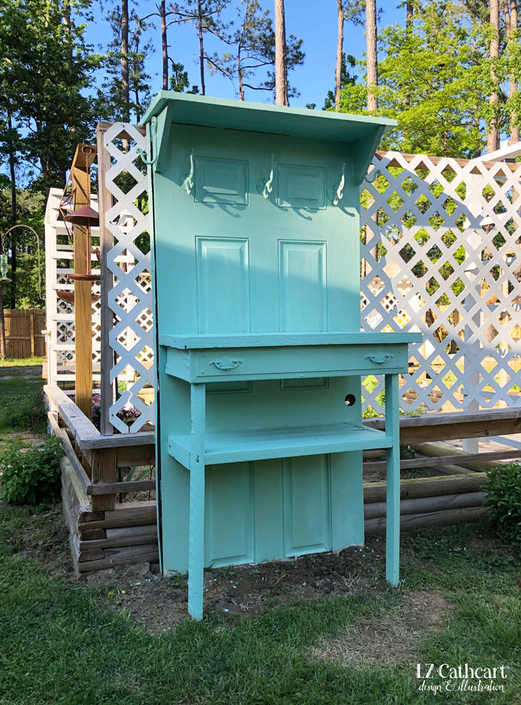 Transform an old door into a beautiful potting bench for your garden. #DIY #PottingBench #Garden